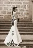 ビンテージゴシックのウェディングドレス黒と白のウェディングドレス恋人のレースのアップリケタフタコルセットブライダルガウン