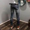 2023 Mens Designers blossade jeans Hip Hop Spliced ​​Fleared Jeans Ejressed Ripped Slim Fit Denim Trousers Mans Streetwear Washed Pants Storlek 28-38