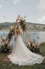 Abiti da sposa bohémien a maniche lunghe Una linea con scollo a V Abiti da sposa da spiaggia con applicazioni in pizzo Abito da sposa Boho senza spalline