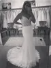 Sexig monterad lång formell sjöjungfru bröllopsklänningar pärlstav spaghetti remsor öppna spets applikationer brudklänningar med domstolståg