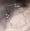 bijoux chaîne clavicule pendentif chaîne de cou de femmes style court été farceur collier de perles de tendance choker