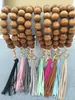 Cross-border hand-beaded wooden bead elastic rope bracelet keychain accessories tassel pendant