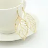 Chaude Mode En Gros Bijoux Creux En Métal Feuilles Pendantes Longue Déclaration Boucles D'oreilles Pour Les Femmes cadeau 2 Couleurs Livraison Gratuite