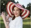 jujuland 2018 Новые летние женские шляпы от солнца Шляпа с козырьком с большими полями Черно-белая полосатая соломенная шляпа Повседневная уличная пляжная кепка для женщин C1902024357