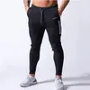 Pantalones de chándal negros para hombre, pantalones de chándal de algodón, pantalones ajustados informales, ropa deportiva para correr en otoño para gimnasio y Fitness