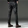 الرجل الجديد جينز الكورية الاتجاه الشباب أزياء نحيل البرية قدم السراويل مصمم سستة مفتوحة بلون الجينز