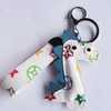 New Dinosaur Designer Keychains PU Leather Flower Animal Bag Charms Keyring Pendants Cute Fashion Gift Car Key Ring Holder Jewelry Key Chain