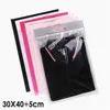 30 * 40 + 5cm 6 färger Handhållen plagg väska Zipper Väskor för kläder Protabel Självtätningsförpackningspåse