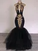 Schwarze billige sexy prom Kleider halbiger Schlüsselloch Tüll Gold Spitzen Applikationen Meerjungfrau Boden Länge Rückenfreie formale Partykleid Abendkleider Verschleiß