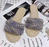 Ny Ankomst Kvinnor Flat Heel Slippers Pearl Beach Hotel Inomhus Utomhus Fårskinn Elektrisk Broderi Ringer Väska Semesterskor SZ34-42