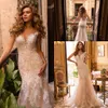 Robes de mariée sexy en tulle à col transparent 2020 dentelle appliques robes de mariée sirène bouton dos sans manches chapelle train robe de novia