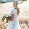 2019 Beach Country A Line Bröllopsklänningar Korta ärmar Juvel Neck Lace Appliques Tulle Sexig Golvlängd Bröllopklänningar Plus Storlek Bohemain