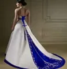 Sexig Backless A Line Bröllopsklänningar Royal Blue With Iovry Broderi Country Wedding Dress 2020 Gothic Halter Sweep Train Satin Bridal Gown