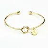 Vendita calda 26 A-Z Lettera inglese Bracciale iniziale Argento Oro Lettera Bracciale con ciondolo Amore Bowknot Polsini Polsini Gioielli da donna