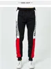 Mäns Casual Pants Side Stripe Letter Printing Men Joggers Sweatpants Hip Hop Man Svart Sweat Pant Slim Monterad Byxor USA Storlek 4sets / Lot