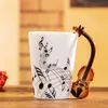 Tasse en céramique de guitare de nouveau design, tasse à café de Note de musique de personnalité, tasse de thé de café de tasses de citron de jus de lait