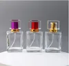 高級50mlの正方形のガラスの詰め替え可能な香水瓶の空のカラフルな化粧噴霧器ポンプのスプレーボトルWB2093
