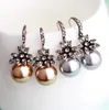 Orecchini a bottone per le donne Temperamento Orecchino di perle Gioielli in argento Fiore del sole Femme Earing Orecchini Bijoux