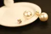 Pendientes de moda ins de estilo al por mayor, aretes de perlas de cristal de circonio súper brillantes de doble cara para mujer de oro blanco