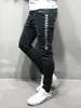 Jeans skinny pour hommes 2019 jeans super skinny masculine pantalon de jean étendue à rayures côté taille élastique grande taille noire