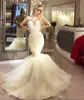 Dubai Sparkly Mermaid Bröllopsklänningar Långärmad Illusion Bodice Major Bröllopklänningar Beading Cascading Ruffles Country Wedding Dress