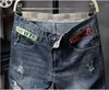 Мода-Высокая улица Разорванные джинсы Мужчины Модные отверстия Дизайн молнии Длинные Брюки для карандашей Slim Fit Брюки одежда