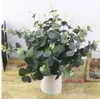 Hojas artificiales verdes, plantas de hoja de eucalipto grandes, Material de pared, plantas falsas decorativas para el hogar, tienda, decoración de fiesta de jardín GA680