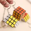 3x3x3cm حجم Magic Size Cube with keychain Puzzle Cube Play Cubes Basovles Games Toy Toy Kids Intelligence Toys Educations Toys