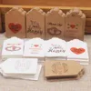 OEM/ODM 100 PCS Natural Kraft Paper Fiyat giysi etiketleri için jüt sicim hediye etiketleri ile kırmızı kalp ile teşekkür ederim DIY el sanatları giyim etiketleri
