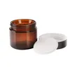 2oz 60ml Amber Glass Rundburkar med vita inre liners och svarta lock. Glassburkar Prefect för kosmetika och ansiktsgrädde