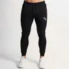 Новые Мужские Joggers Повседневная Брюки Фитнес Спортивная одежда Дне туна Скинни Друщеные Двухселистые Брюки Мужские Тренажеры Тренировки CrossFit Brand Track Брюки