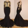 Sexy Black Mermaid Evening Dresses Jewel Neck Backless Long Sleeves Gold Lace Appliques Crystal Beaded Sweep Train Prom Dress Party Gowns