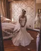 Afryki Tanie Syrenki Suknie Ślubne Jewel Neck Illusion Pełne Koronkowe Aplikacje Długie Rękawy Plus Rozmiar Tulle Sweep Pociąg Formalna Sukienka Bridal