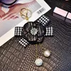 Rhinestone Ball Sleutelhangers Sleutelhangers Houder Plaid Boog Camellia Bloem Sleutelhanger Ring Sieraden Gift Mode Vrouwen Meisjes Parelzak Charms voor Auto