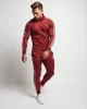 red black tracksuits