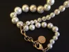 Collier de perles de créateur classique du 100e anniversaire de la mode pour femmes, fête, amoureux de mariage, cadeau de fête des mères, bijoux pour mariée avec sac en flanelle