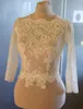 Maßgeschneiderte weiße Elfenbein-Hochzeitsjacken Illusion Langarm Vintage-Spitzen-Bolero-Jacke für Brautparty-Abendkleider Frauen Plus 290R