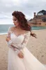 Eleganckie koronkowe aplikacje A-line suknia ślubna Sheer Scoop Long Rleeves Tiulle Boho Wedding Suknie Vestido de Novia Beach Sukienki