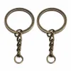 60st / lot nyckelring nyckelring brons rhodium guld färg 28mm lång runda delade nyckelringar Keychain smycken gör grossist