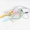 Giocattolo per la dentizione del bambino Silicone + addestramento in legno Collana per massaggiagengive per bambini Collana con pendente in piuma Giocattolo da masticare Regali Perline Clip per ciuccio