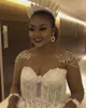 Luxe cristal princesse robe de bal robes de mariée 2021 illusion à manches longues dos ouvert dentelle perles gland robe arabe Dubaï robes de mariée