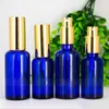 Bouteilles de parfum rechargeables bleues vides portatives en verre portatives de la bouteille 30ML avec la pompe pour l'emballage cosmétique à vendre