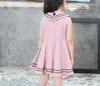 品質の赤ちゃん女の子ブティック服プリンセスコットンネイビースタイルの弓ドレス女の子スカート女の子衣装子供パーティー服5彩XZT049