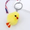 10st / lot-söt riktig äkta päls anka chick pompom boll väska charm keychain hängsmycke nyckelring gåva