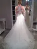 2022 Nouvelles Robes De Mariée Sirène Avec Manches Longues Tulle Sheer Col En V Perlé Sequin Dentelle Appliqued Sexy Boutons Couverts Vestidos De Novia