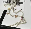 女性のための長いシミュレートされた真珠のネックレス5ペンダントロングネックレストレンディなデザインスタイルパールタッセル