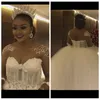 Vestidos de novia africanos de talla grande con escote transparente Vestidos de novia de cristal con cuentas Cristales de abalorios Vestidos de novia Tul vestido de novia