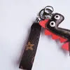 Nowy Dinozaur Designer Breloki PU Skórzany Kwiat Zwierząt Torba Charms Keyring Wisiorki Słodkie Moda Prezent Samochód Key Pierścionek Uchwyt Biżuteria Klucz Łańcuch