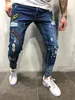 Modna odznaka męskiej dziury haft dżinsowe spodnie Męskie streetwear Hiphop Chuda Casual Patch Jeans254r