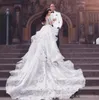 Vestidos de novia con cuentas de encaje de lujo 2019 Ilusión de cuello alto Vestidos de novia de manga larga Faldas con gradas Vestidos de boda con espalda transparente saudita